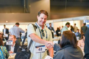 Man shaking a woman's hand at WYSTC business appointment